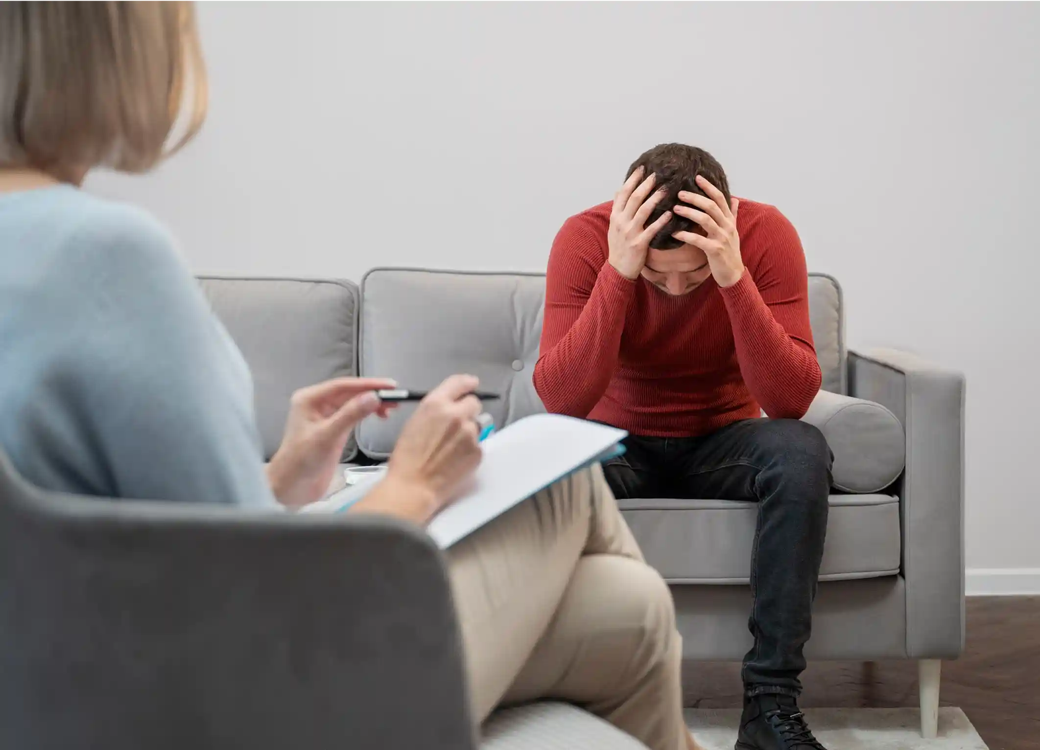Person opening up to a mental health professional about depression